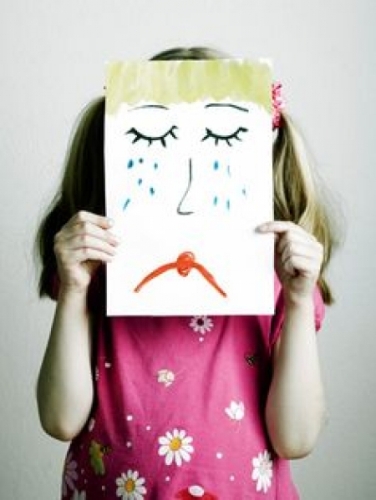 a-girl-with-a-picture-with-sad-face